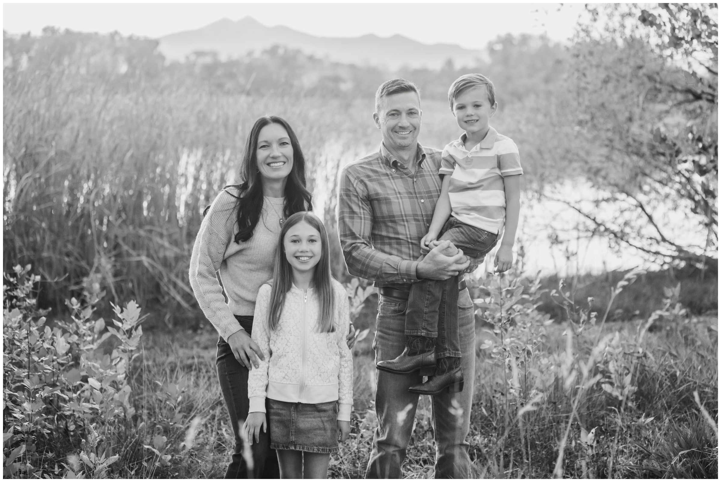 family posing by Highland Lake in Northern CO by Plum Pretty Photography 