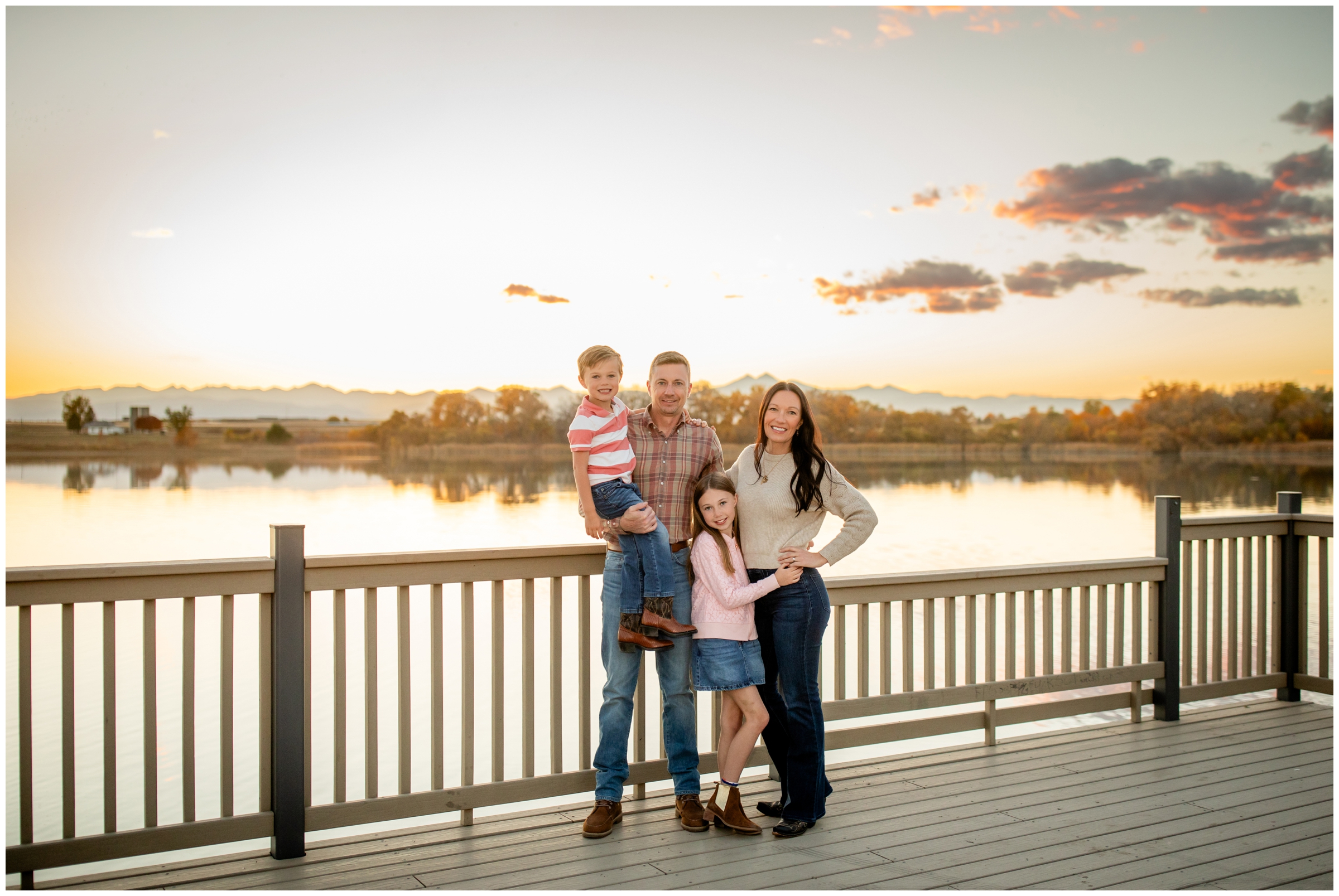 family posing on dock of Highland Lake during Northern CO photography session 