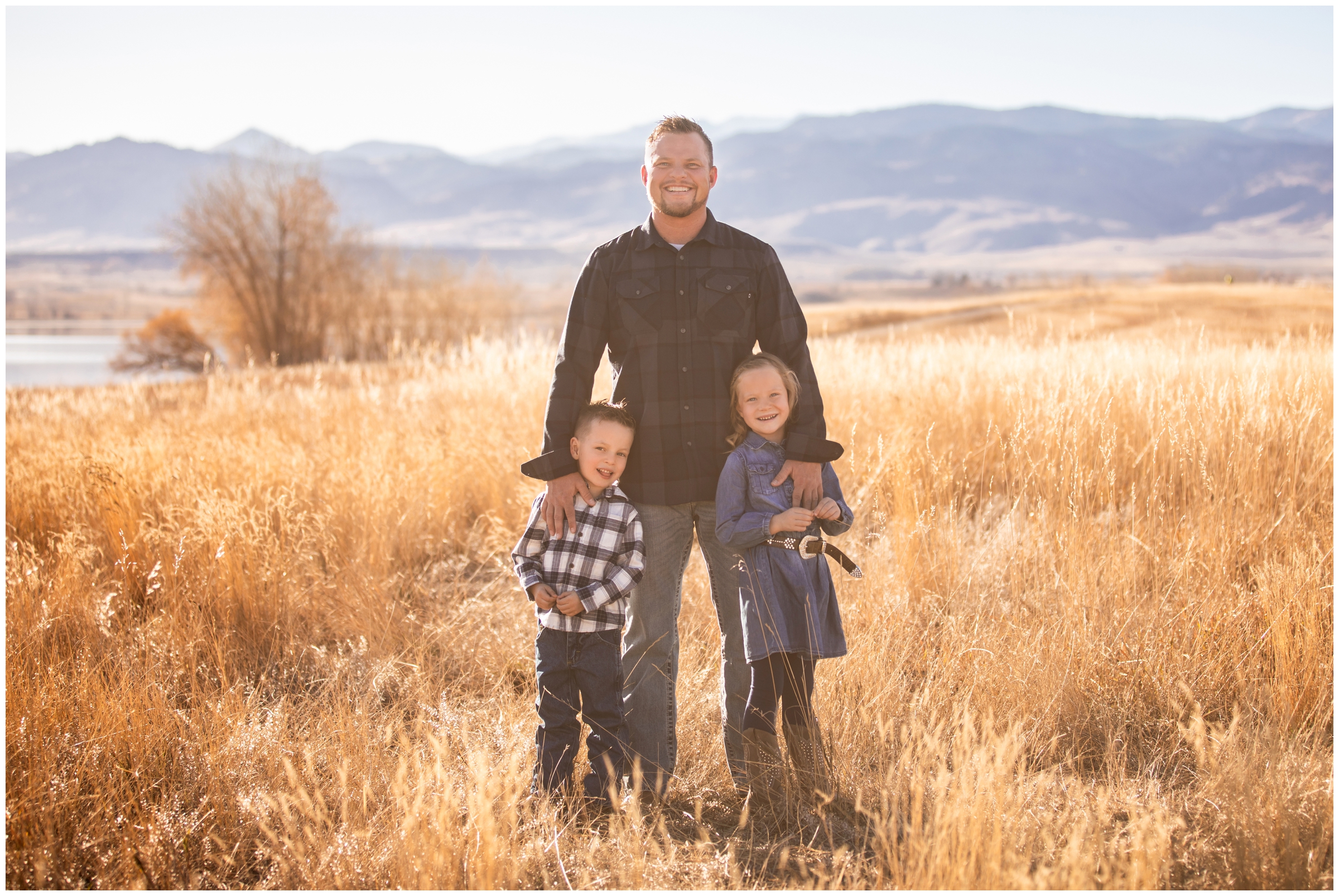 dad with kids posing in a mountain field during Boulder family photography session at Coot Lake Colorado 