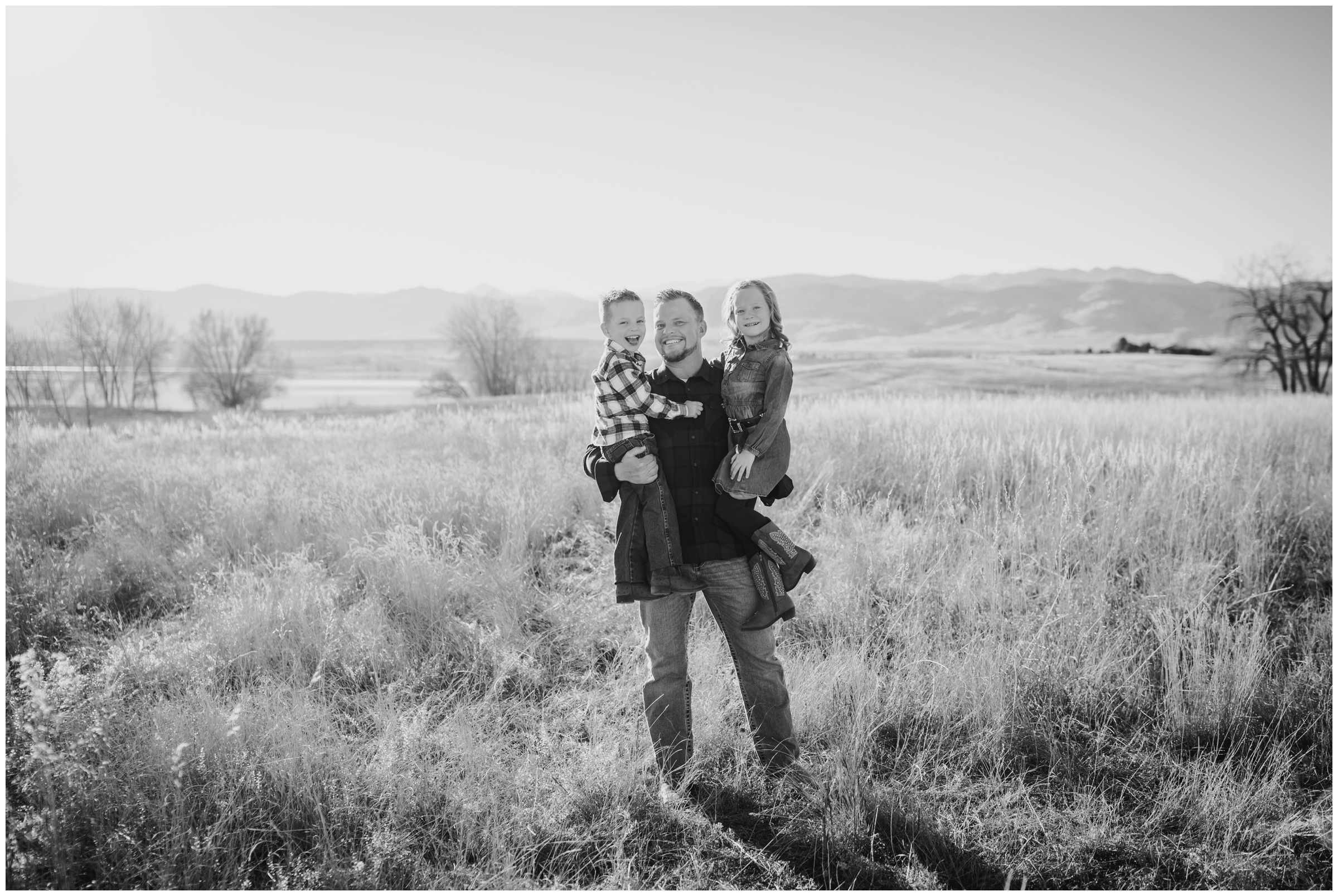 dad and children posing in mountain field during fall mini session at Coot Lake